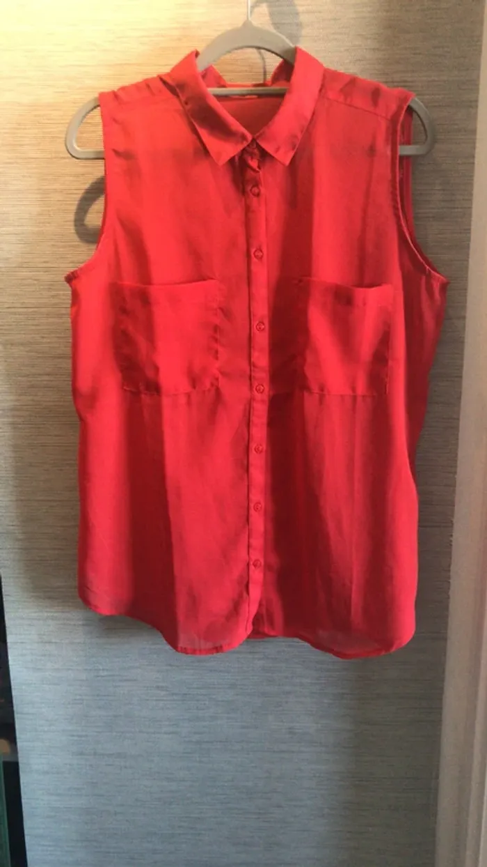 Chemise sans manche rouge Taille L