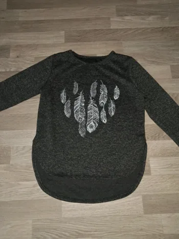 Pull femme plumes