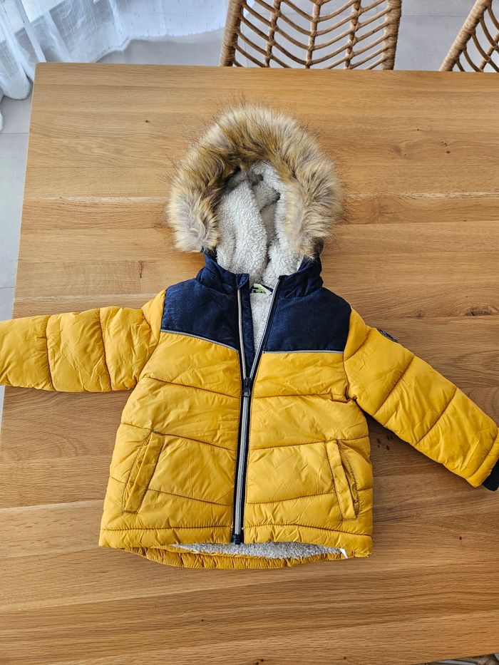 Manteau fourré tape à l'œil