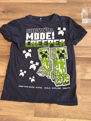 Je vend un tee shirt garcon enfant taille 11-12 ans bon état 