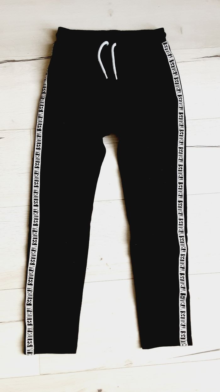 Vêtement mixte garçon fille pantalon jogging survêtement noir bande blanche 10 ans