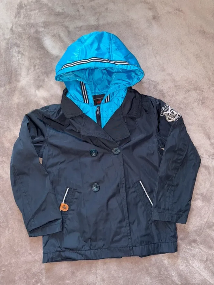 Blouson imperméable garçon catimini taille 6 ans en très bon état. Bleu ciel et bleu marine. - photo numéro 10