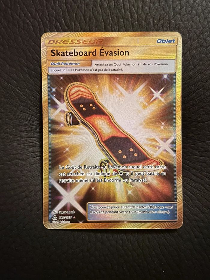 Carte Pokémon Skateboard Évasion Gold Ultra Prisme 167/156