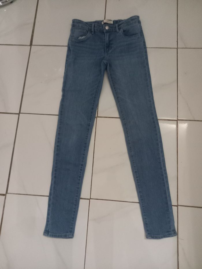Levi,s fille taille 14 ans couleur bleu clair tres bonne etat - photo numéro 10