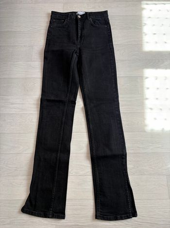 Jeans noir fendu 