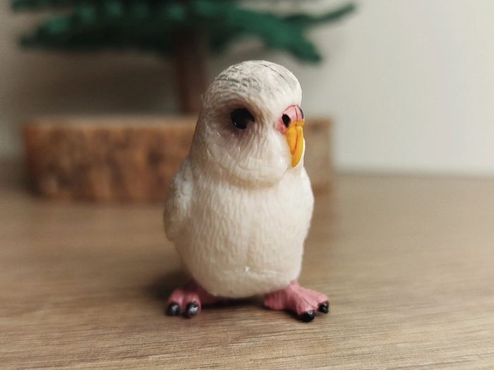 Figurine perruche blanche et grise