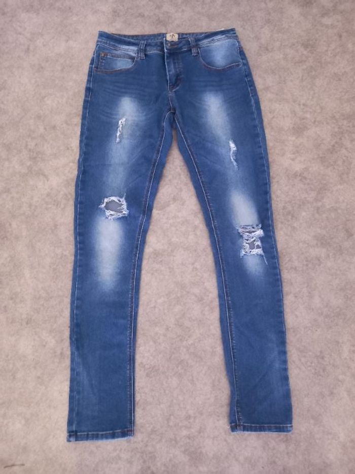 Pantalon trouee