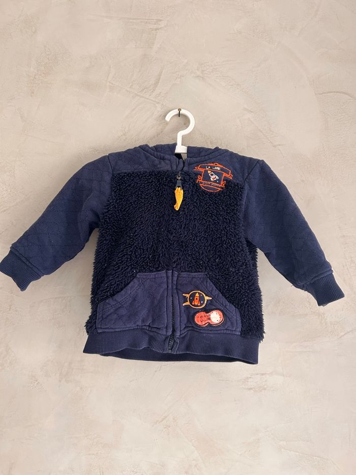 Gilet épais à capuche