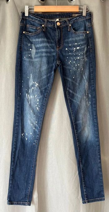 Jean femme Slim mango effet taché peinture blanche en très bon état taille 36