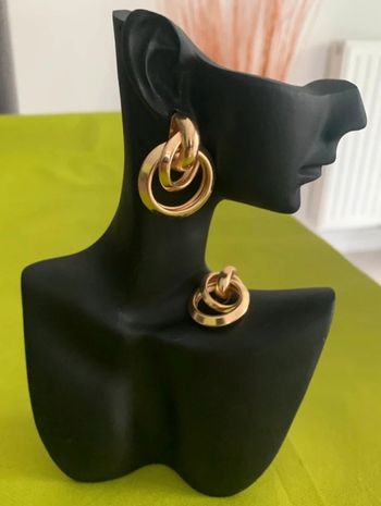 Boucles d’oreilles créoles noeud en alliage doré