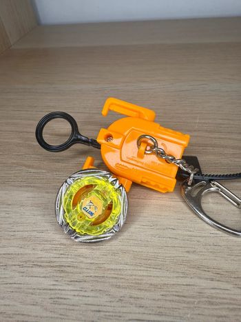 Porte clés flame sagittario toupie beyblade
