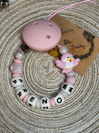 Attache tétine oiseau