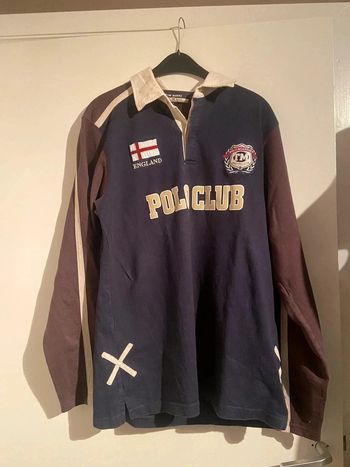 Polo longue mange avec logo dans le dos