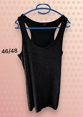 Belle robe mi longue noire argentée 46/48 Très bon état  Longueur 96 cm env, matière stretch