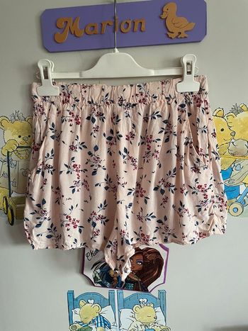 Short rose pâle tirant sur le pêche/abricot à fleurs, taille 36, marque H&M