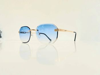 Lunette de soleil mixte percée dorée verres bleus dégradés UV protection catégorie 1