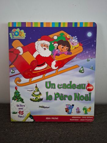 Grand livre cartonné DORA  "Un cadeau pour le père Noel"