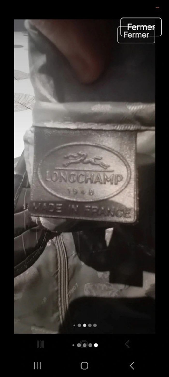 Sac longchamp grande capacité en porte épaule en cuir croco l état du sac en photo 
26x37x12 - photo numéro 13
