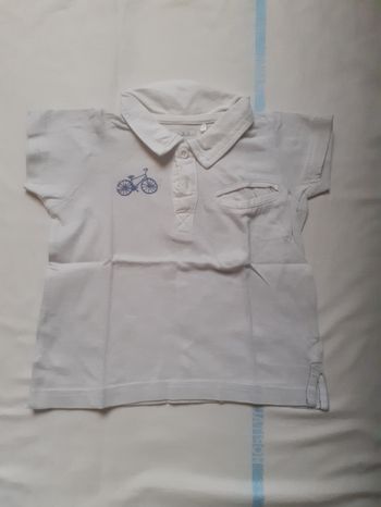 Polo blanc avec motif vélo bleu