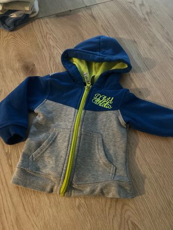 Gilet zip à capuche