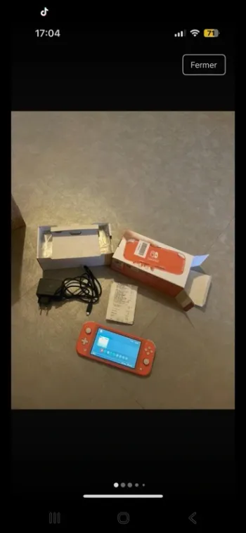 Nintendo switch lite rose encore sous garentie 2 ans
