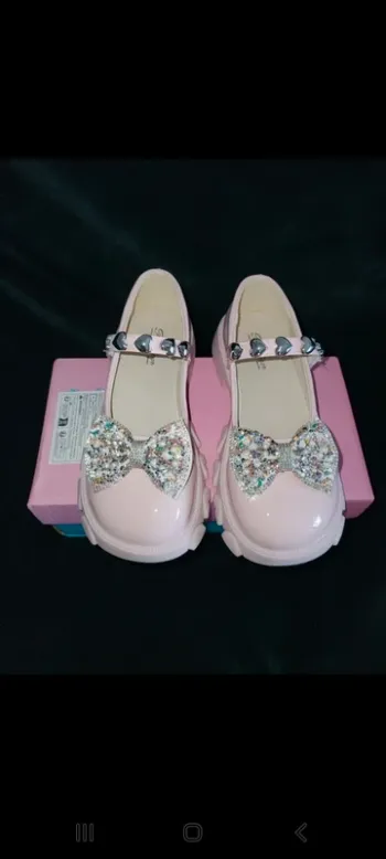 Chaussure rose claire avec papillon