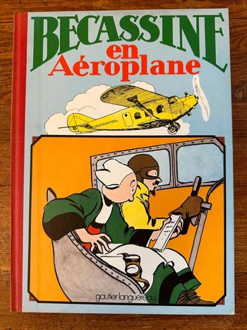 Livre album ancien vintage Bécassine en aéroplane avion reliure rouge Gautier Languereau