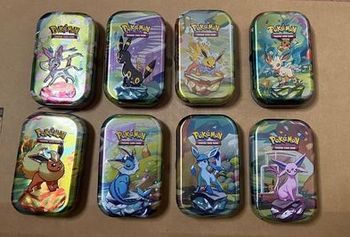 Mini tin EV 8.5 évolution  Prismatique lot de 1 scellé + 7 vides