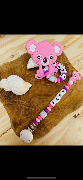 Attache tétine anneau de dentition