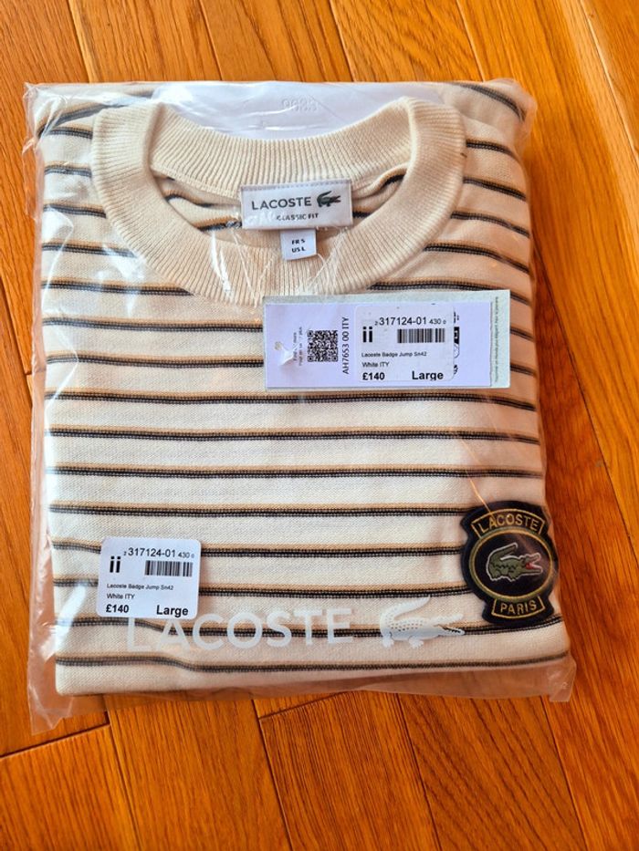 Pull "Lacoste" Blanc à rayures Taille L  Taille L neuf sous blister 100 % coton organique.