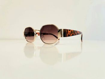 Lunette de soleil mixte hexagonale dorée verres dégradés bras marron léopard uvprotection cat 3