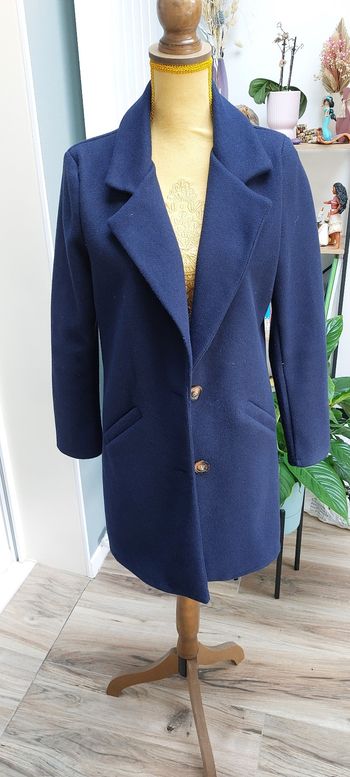 Manteau bleu de l'armoire de Suzette