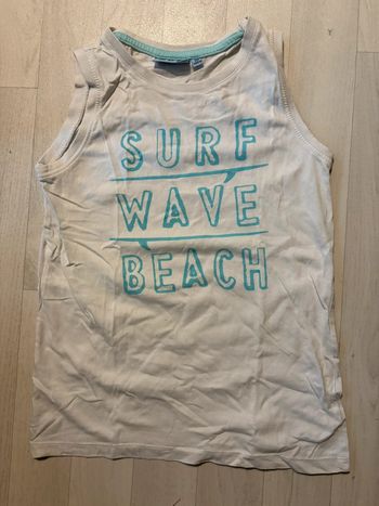 Débardeur NKY 10 ans blanc écriture turquoise très bon état