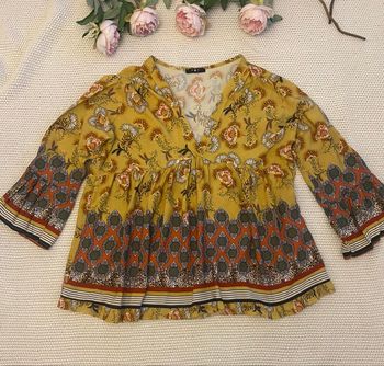 Blouse fleuri aux motifs colorés, très bon état , taille 38