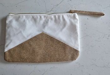 Pochette prodigieuse blanc et doré Nuxe