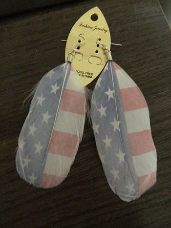 Boucles d'oreilles plumes neuves