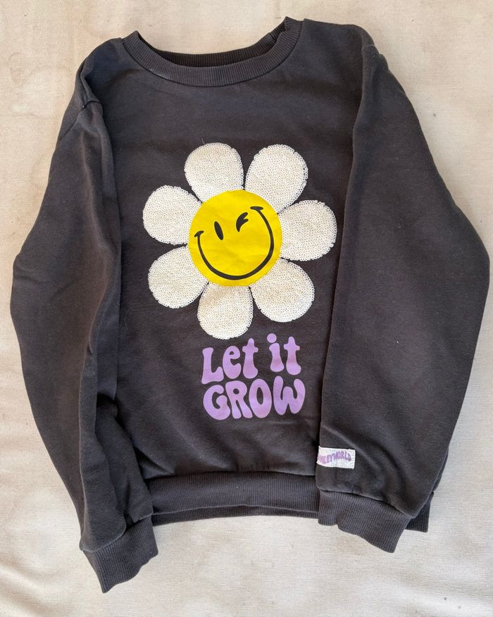 Sweat noir fleur smiley (122/128)