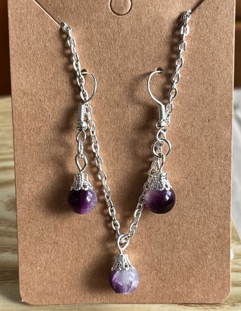 Collier et boucles d’oreilles perle violet