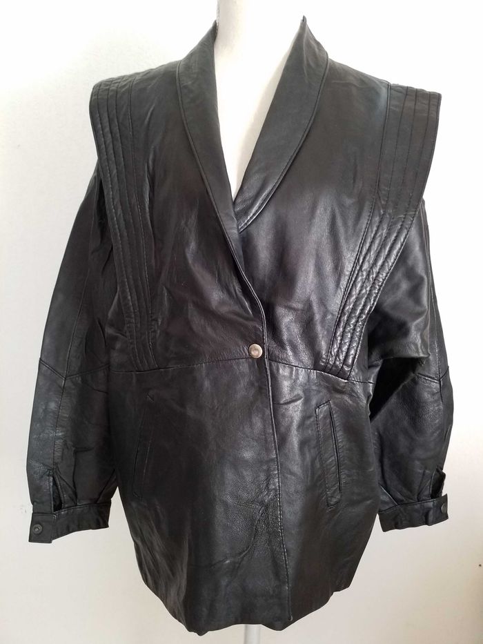 Veste noire en similicuir taille 44/46