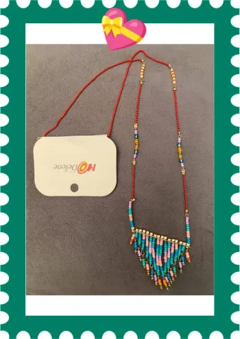 Magnifique sautoir bohème avec pendentif breloques et perles multicolores