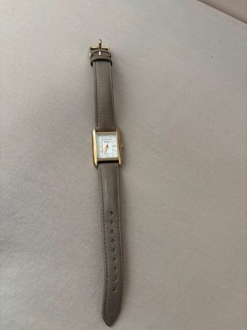 Montre fossil boîtier doré et bracelet cuir gris