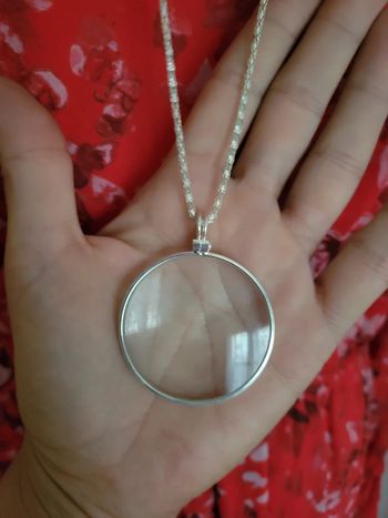 Sautoir en acier silver loupe.