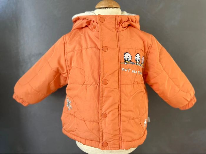 Manteau orange Disney bébé