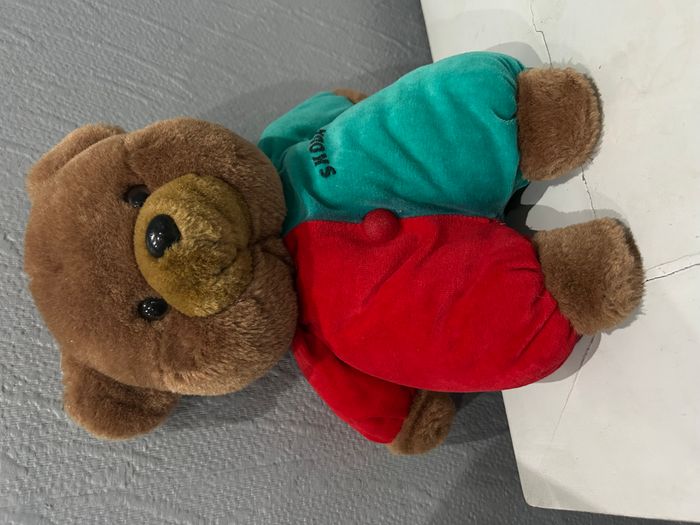 Ours brun habillé bi colores imprimé publicitaire