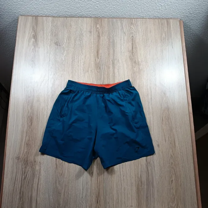 Short gymshark homme bleu M