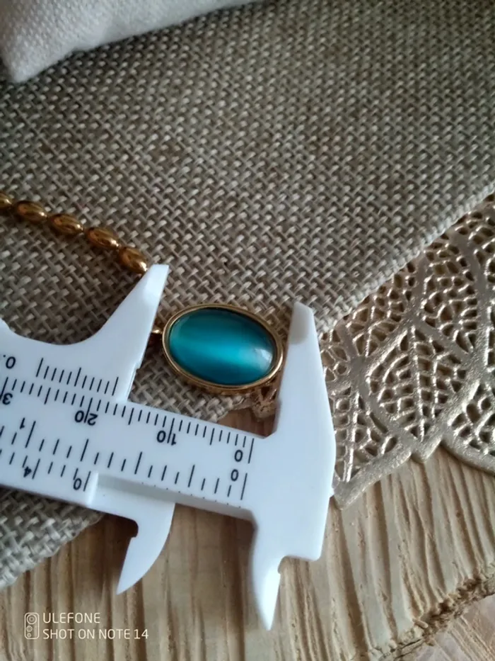 Collier pierre oeil de chat bleu intense - photo numéro 2