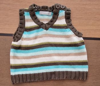 Pull sans manches rayé  6 mois en parfait état