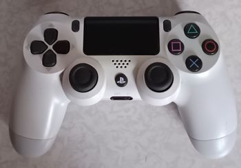 Manette ps4 blanche officielle Sony en très bon état