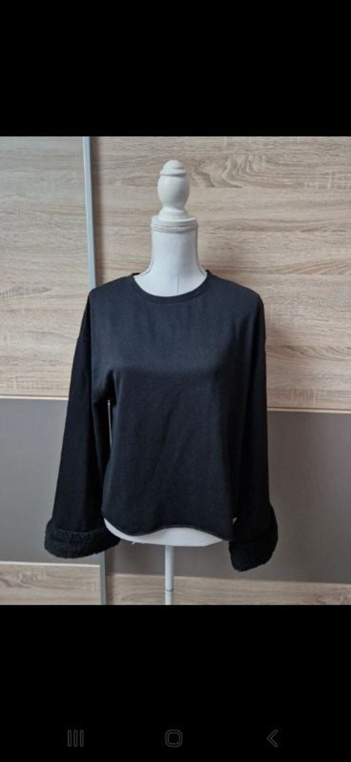 Pull manches évasées