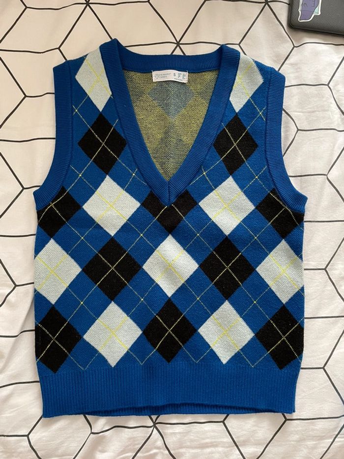 Pull sans manches à carreaux col v